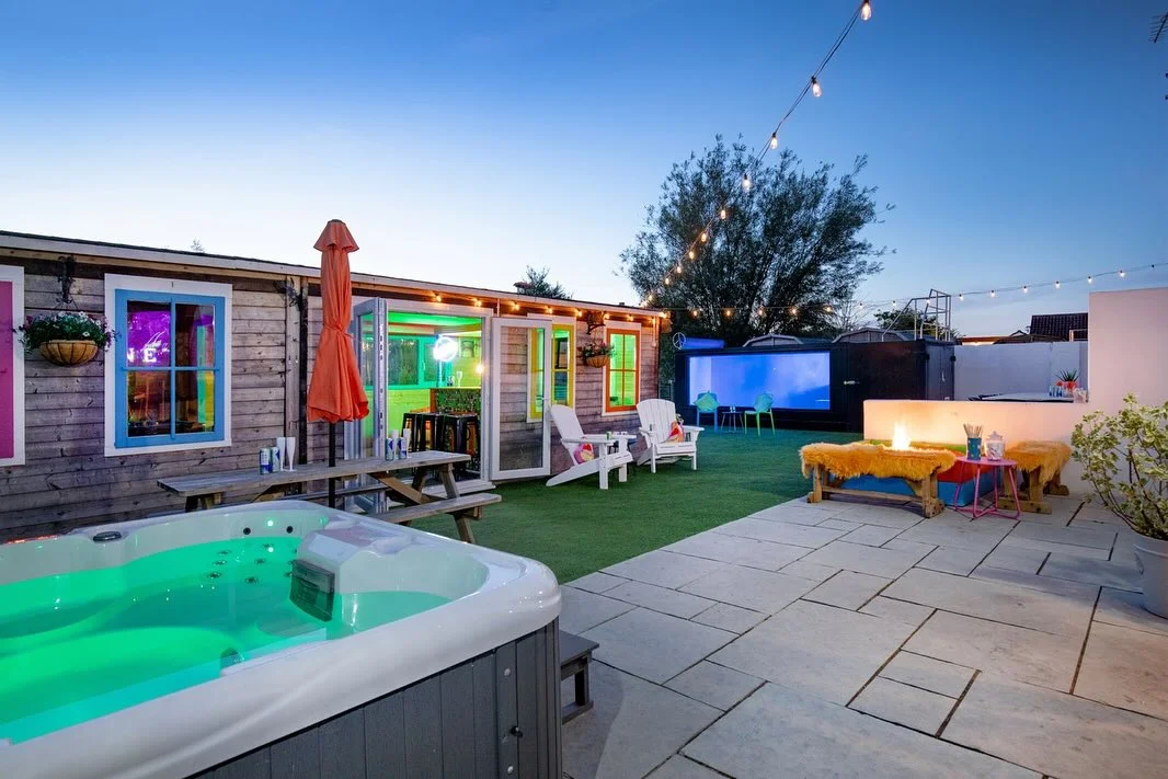 Our (Halula) Oasis, nestled in the Somerset country side 💚

The new shipping container pool is a fun addition to the garden. With the glass front and neon lights it is the perfect backdrop to some fabulous photos! 📸

The property is bursting with colour and endless amenities ⬇️

🛌 Sleeps 24 
🎬 Cinema room
🏊‍♀️ Shipping container pool
💃 Silent disco
💄Glam area
🛝 Slide and ball pit
🦘 Trampoline & Play park 
🔥 Fire pit
🎱 Pool table
⚽️ Table football
🏓 Beer pong 
🍴 Indoor & outdoor dining for all 24 guests
🫧 Hot tub 
🥂 Pool house and bar 
🍗 BBQ

Full details and more pictures on our website! 👩‍💻