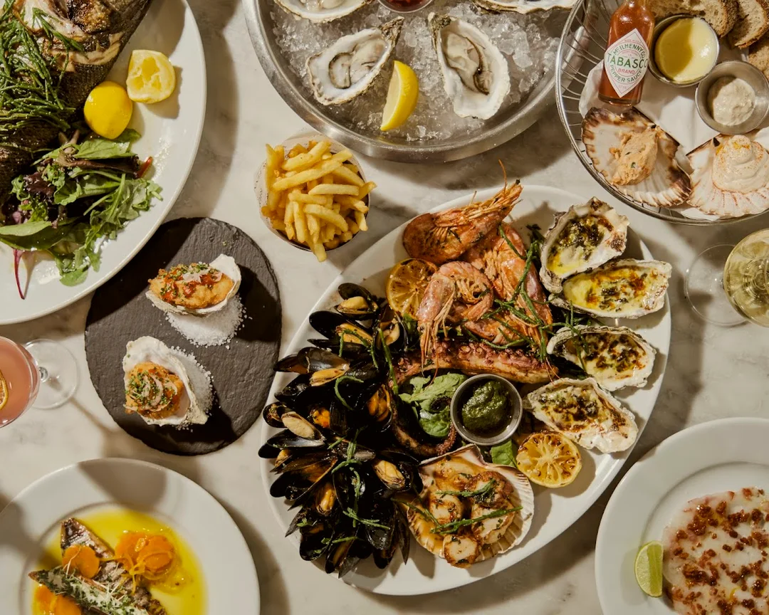 Sophisticated seafood and champagne at Brighton's iconic Riddle & Finns - perfect for a classy hen lunch.