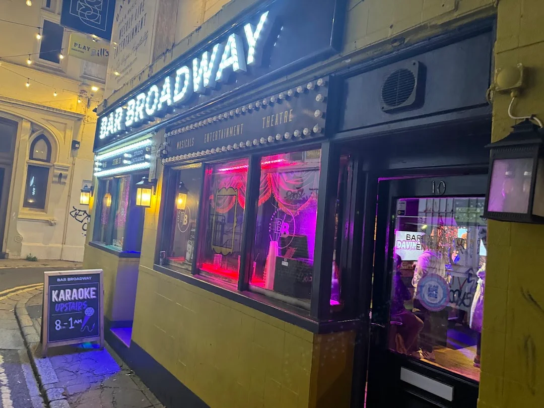 The vibrant interior of Bar Broadway in Brighton, known for its drag shows and lively atmosphere.