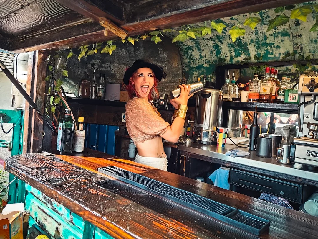 A mobile bartender teaching a hen party how to make molecular cocktails at their accommodation.