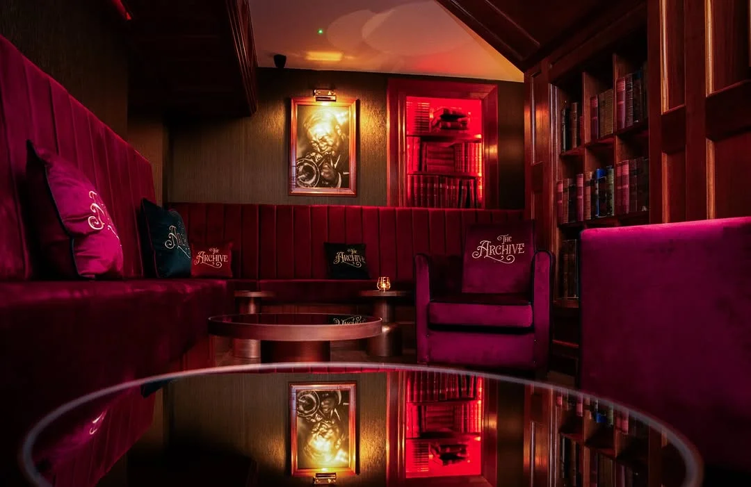 The secret bookcase entrance or stylish 1920s interior of The Library speakeasy.