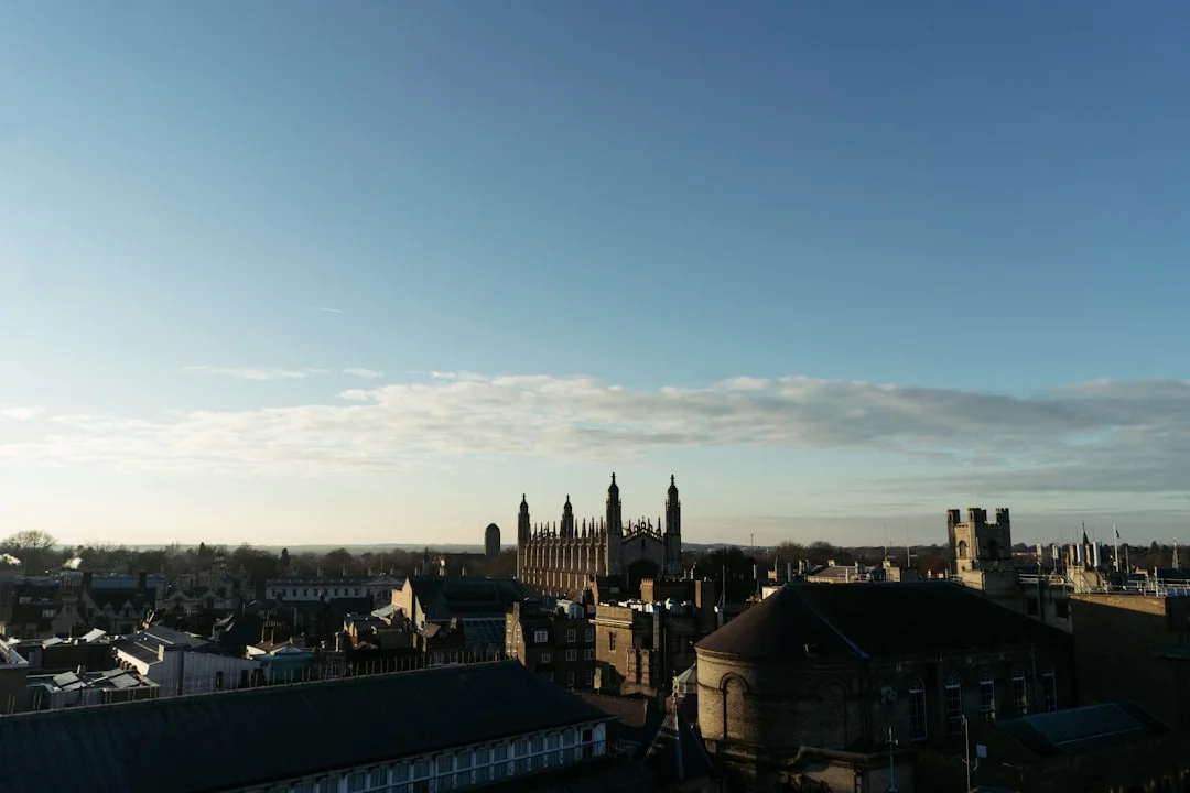 Golden hour view of Cambridge skyline from Castle Hill, featuring King's College Chapel and the city spires
