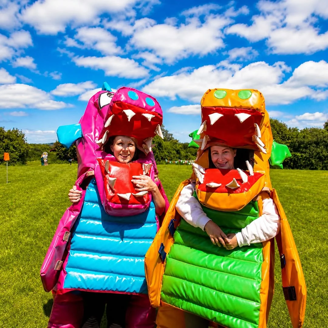 A hen party group competing in a fun, inflatable-based activity at Welsh Games near Cardiff.
