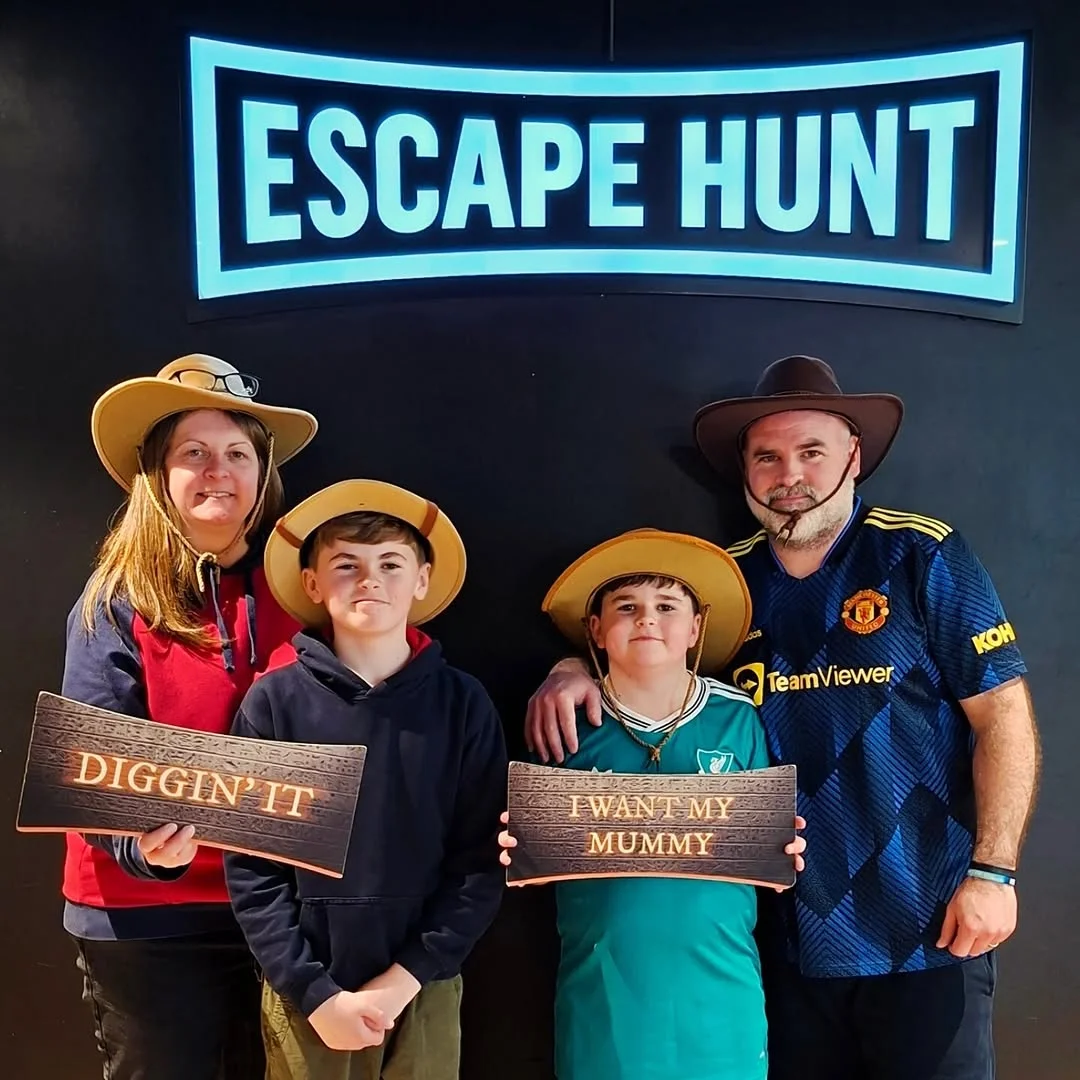 A group of friends working together to solve a puzzle in an escape room.