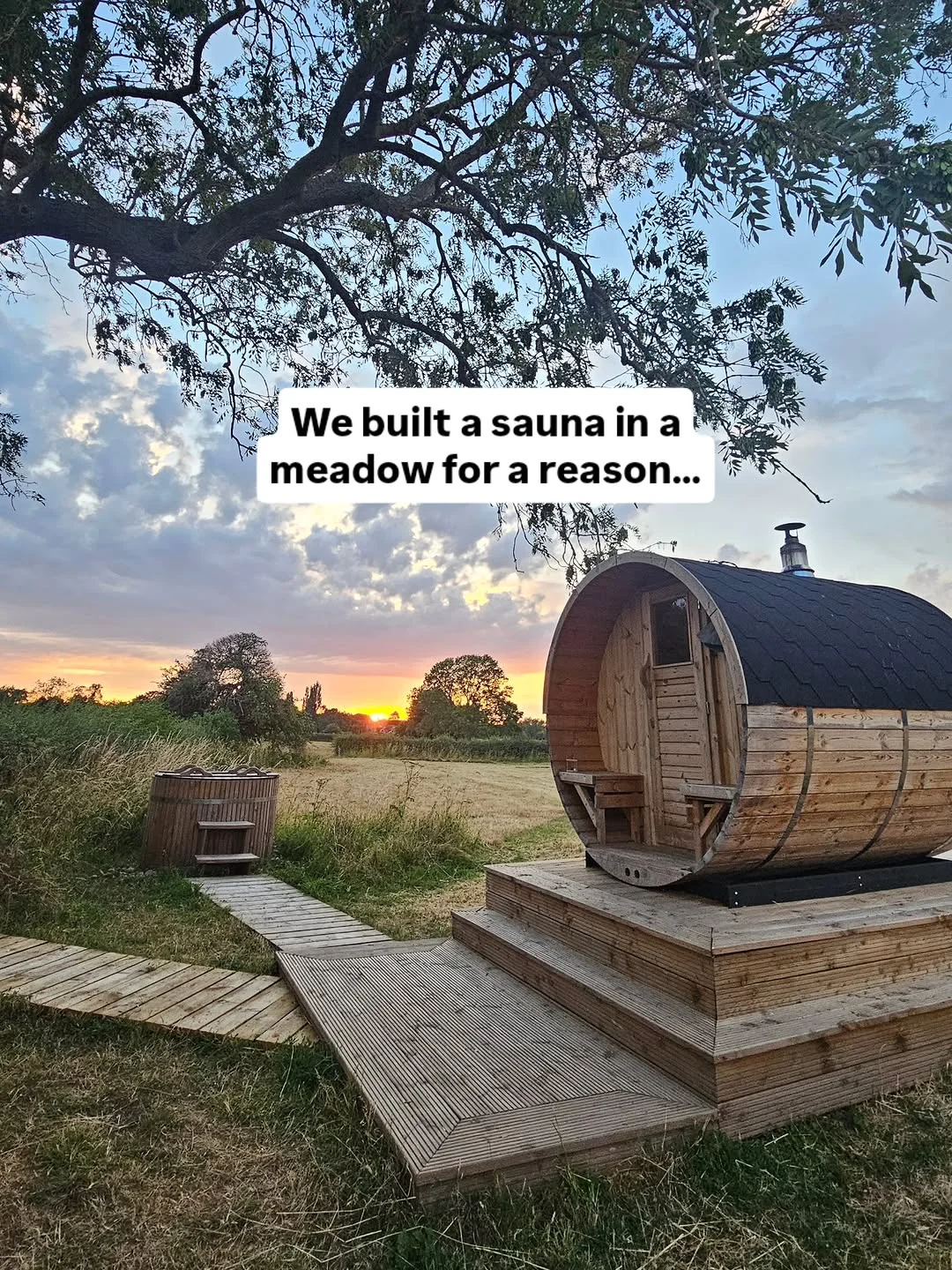 A rustic wood-fired sauna in a peaceful meadow setting at The Sauna at the Cottage.