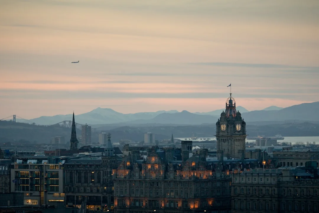 Dusk view of Edinburgh from Calton Hill with Balmoral clock tower and Edinburgh Castle