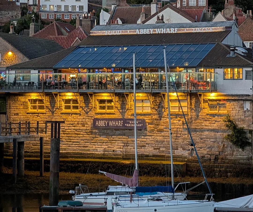Sip cocktails with a view at Abbey Wharf - the perfect spot for a sunset toast in Whitby.