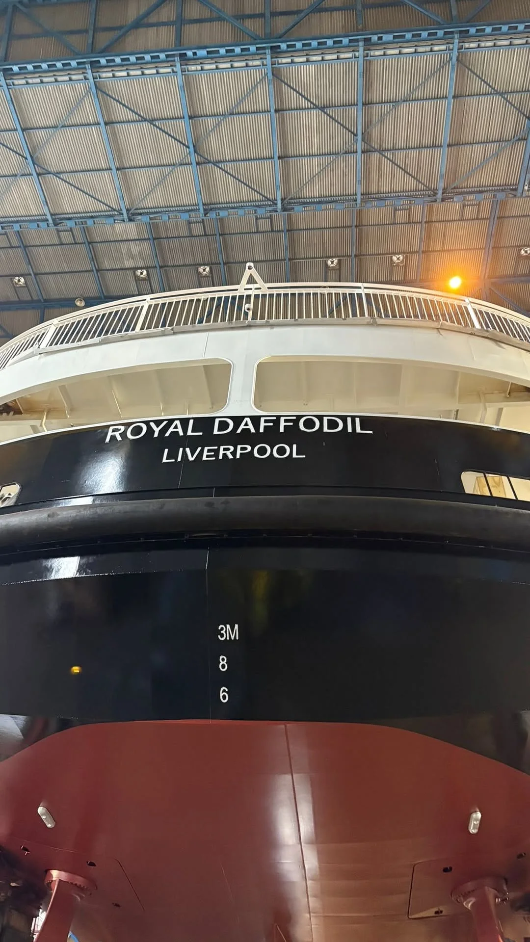A Mersey Ferry boat on the river with the iconic Liverpool skyline in the background.