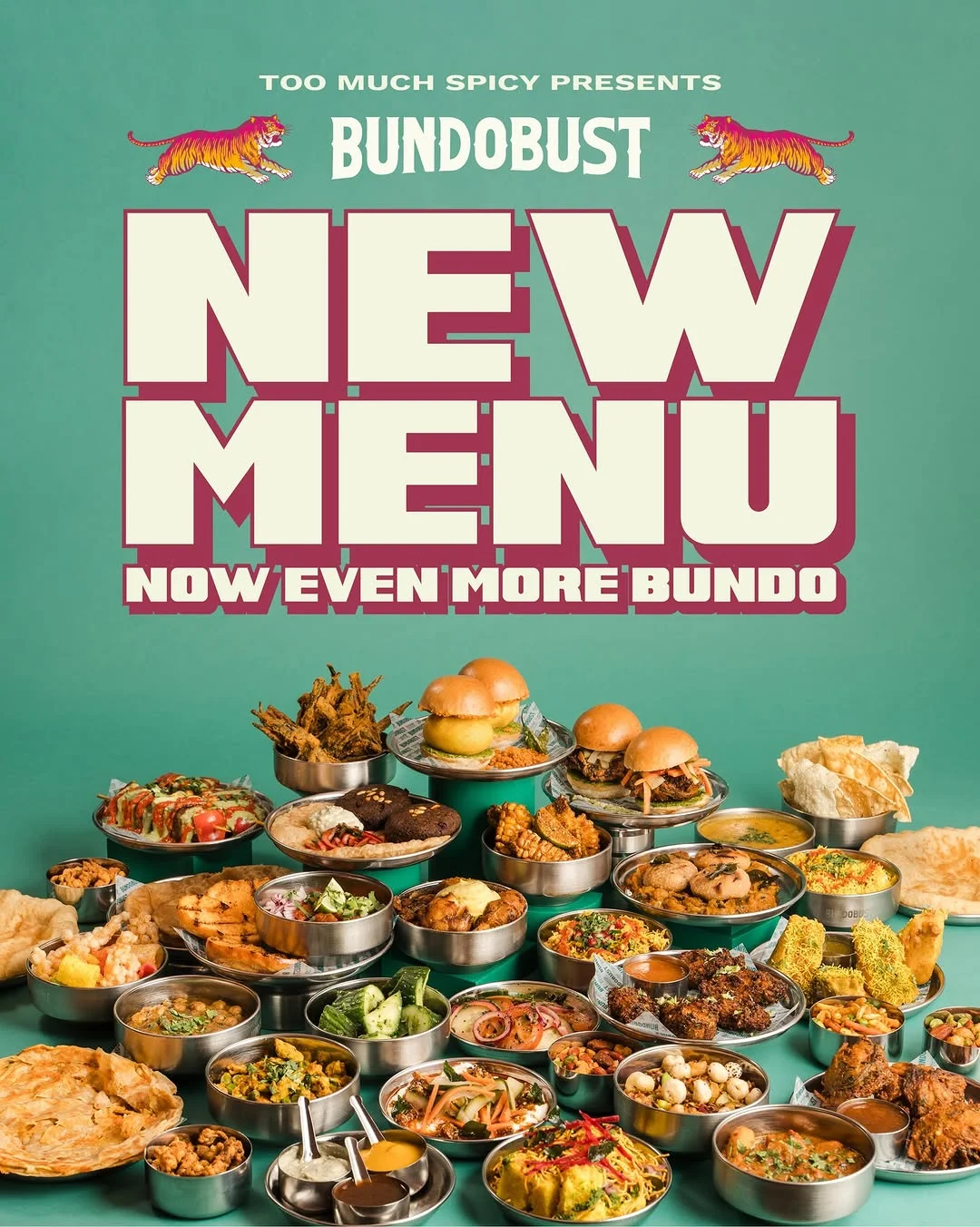 A long communal table laden with Indian street food dishes and craft beers at Bundobust.