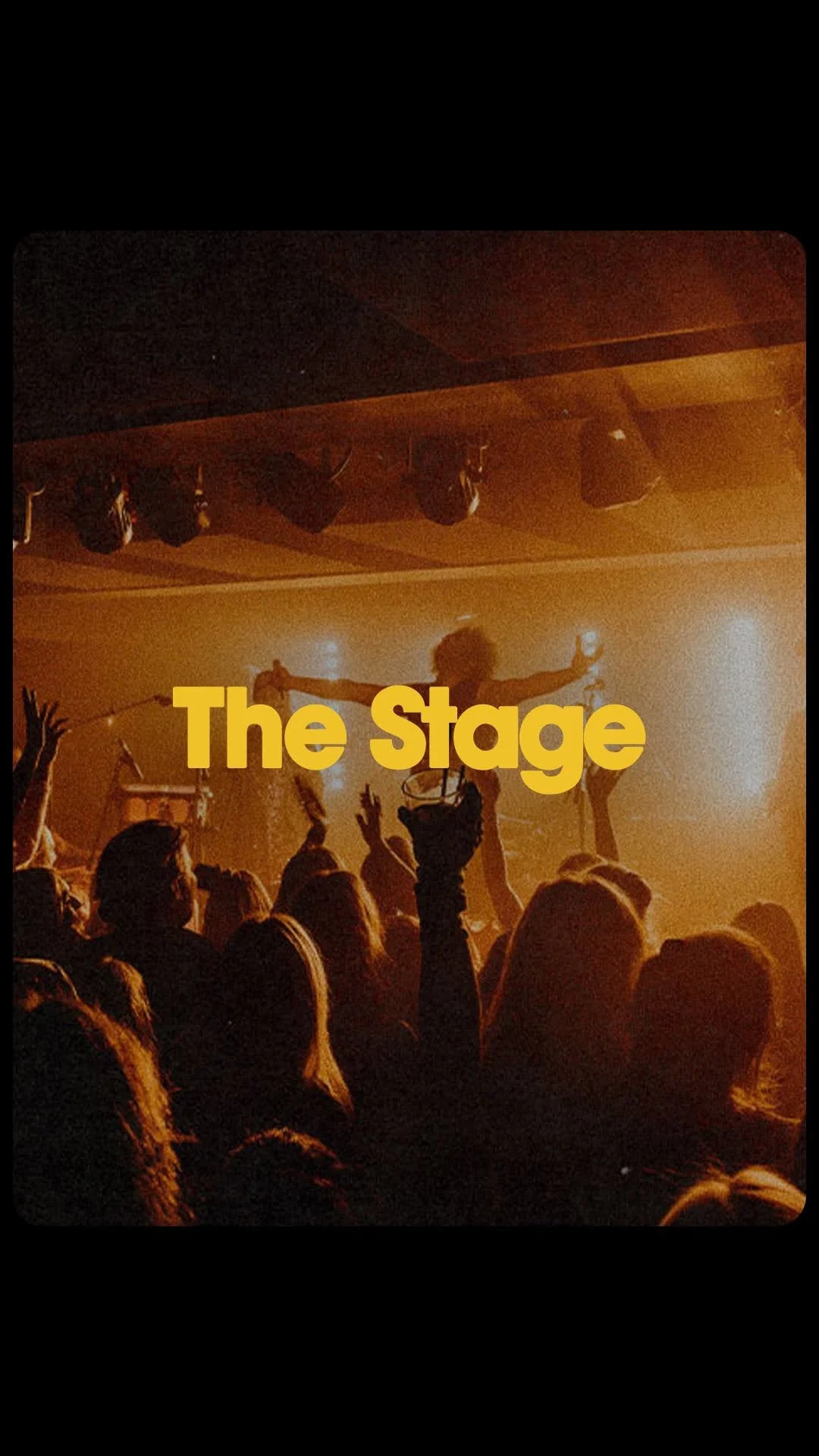 A live band playing on stage to a crowd at The Blues Kitchen in Manchester.