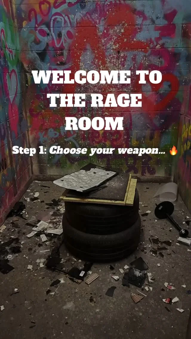 A person throwing an axe at a wooden target inside Hatchet Harry