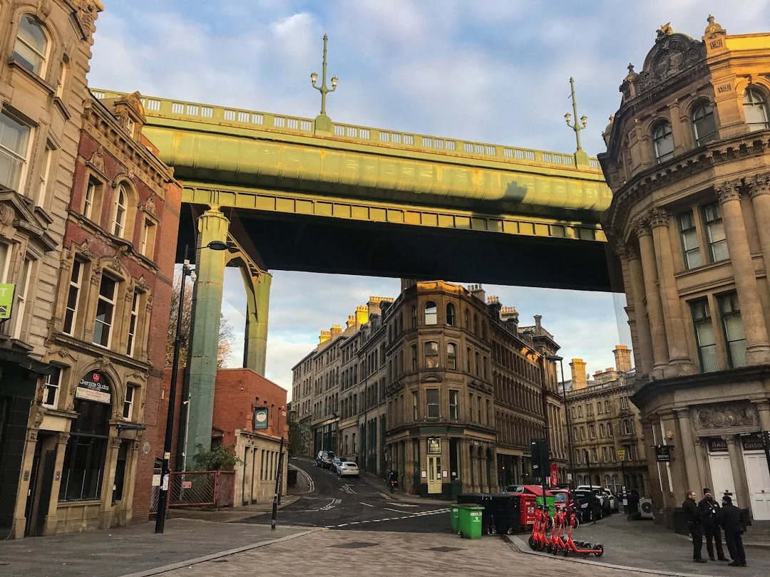 Grey Street in Newcastle with elegant Georgian buildings and the Theatre Royal spire