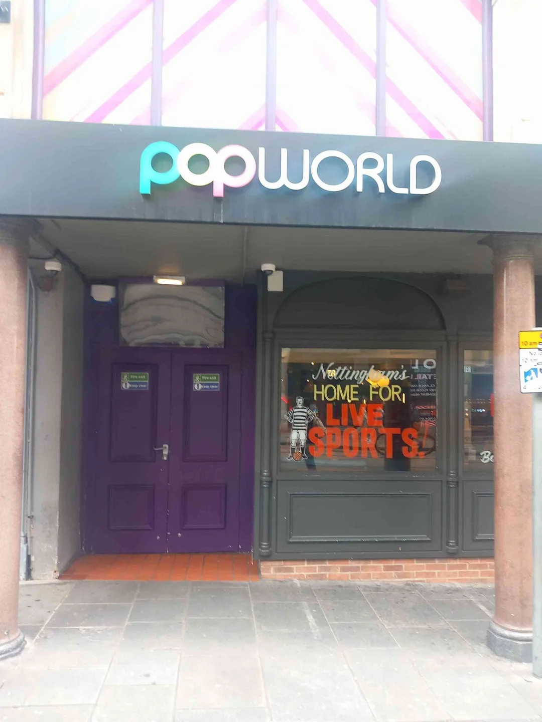 A vibrant dance floor at Popworld Nottingham, with colourful lights and people dancing to classic pop hits.