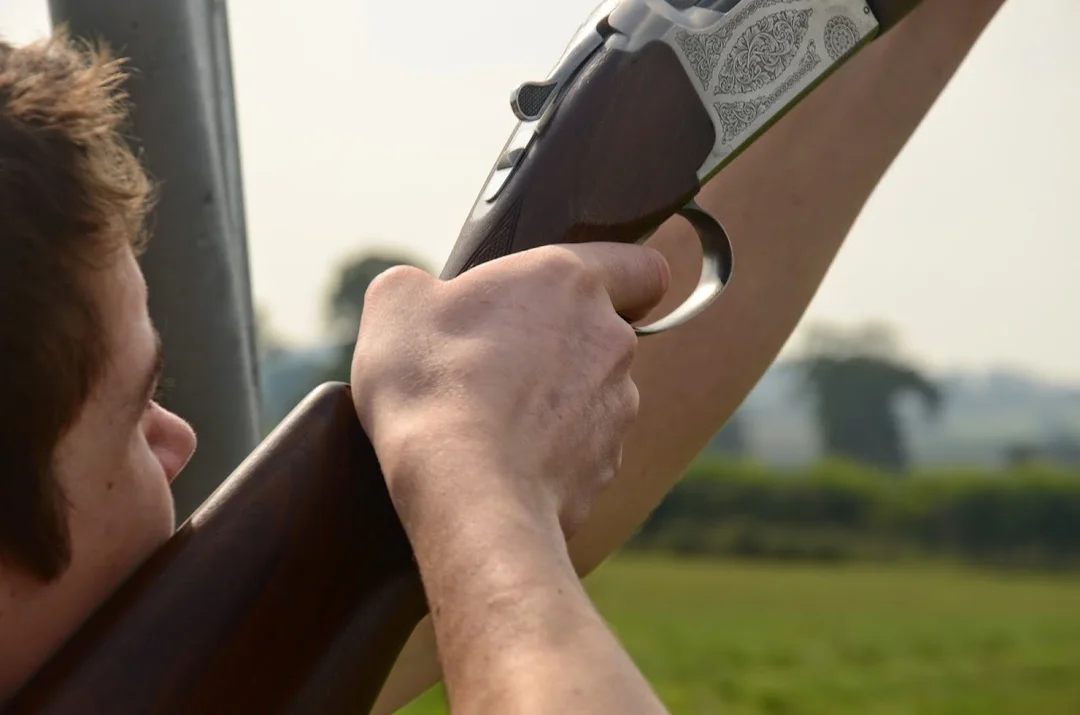A group participating in a clay pigeon shooting session at AA Shooting School near Weymouth.